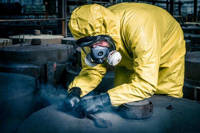 Man working with chemicals in protective wear